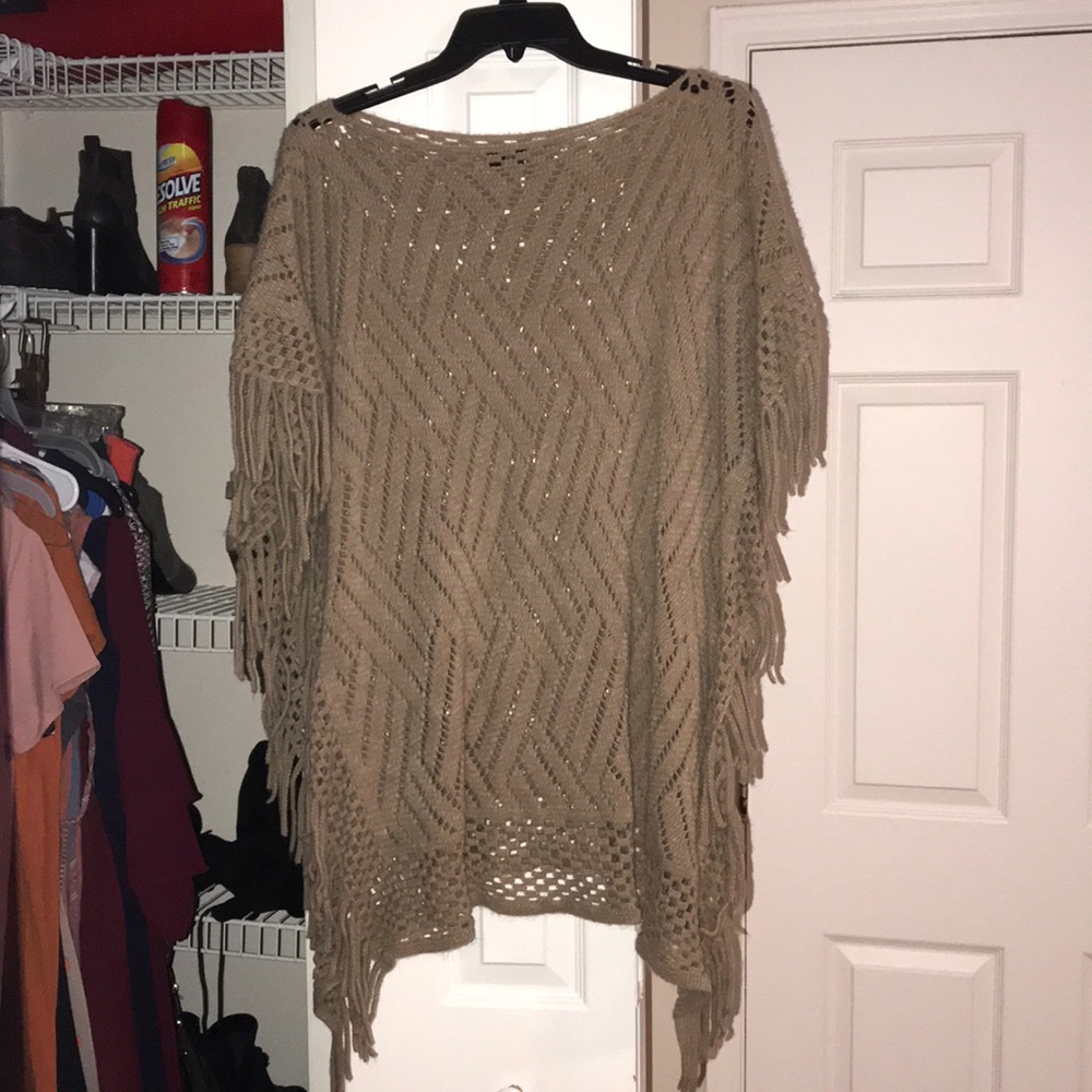 Tan poncho. Like new condition. One size fits all